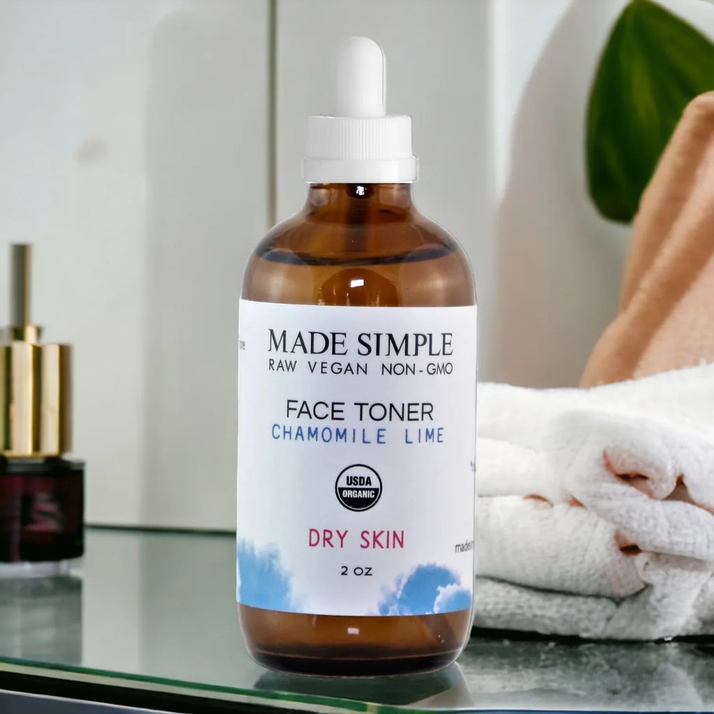 Organic chamomile lime face toner for dry skin in amber bottle on bathroom counter