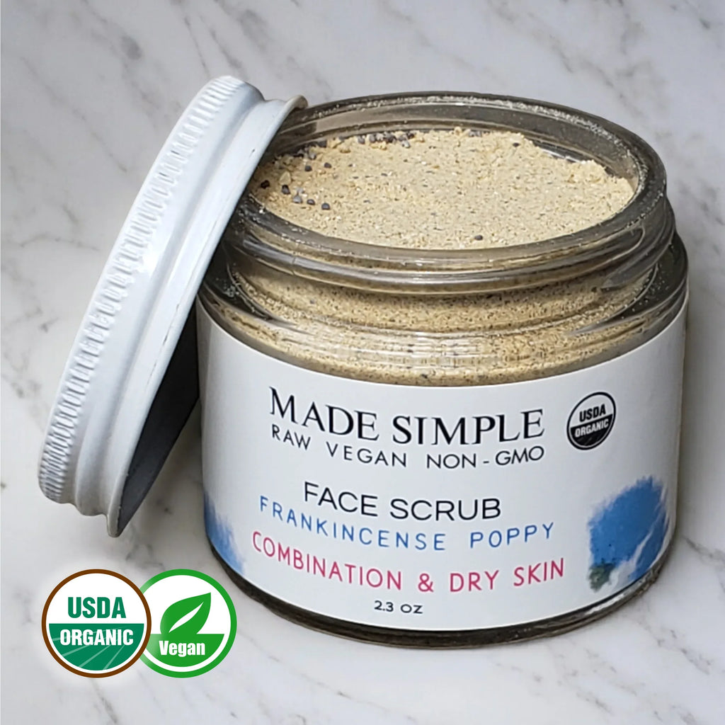 Organic vegan face scrub jar for combination and dry skin on marble surface