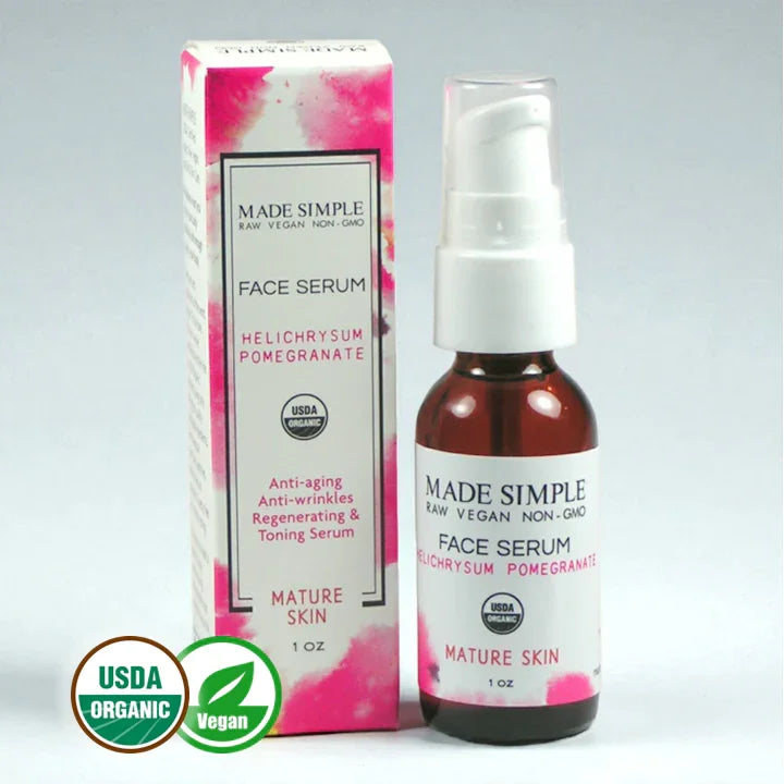 Organic vegan face serum for mature skin with helichrysum and pomegranate, boxed packaging.