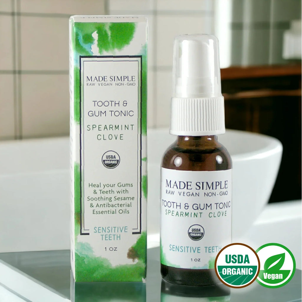 USDA organic vegan tooth and gum tonic spearmint clove for sensitive teeth, bathroom setting