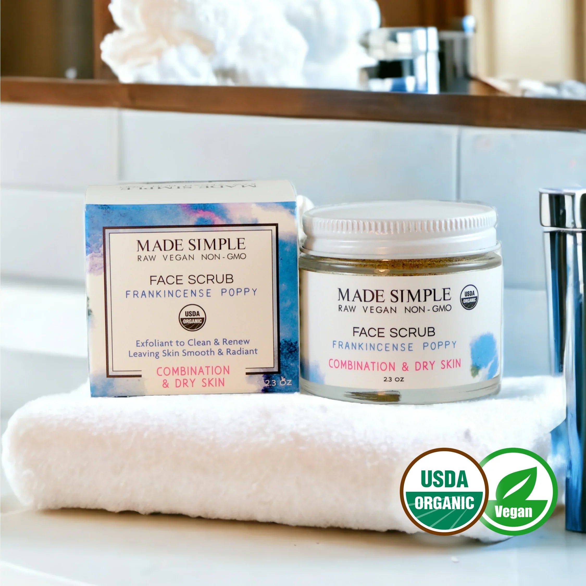 Organic vegan frankincense poppy face scrub for combination and dry skin on a towel in bathroom