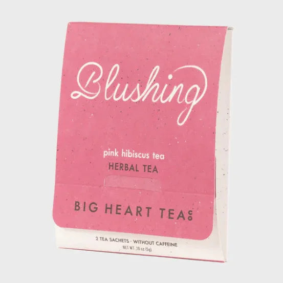 Blushing pink hibiscus herbal tea box by Big Heart Tea, caffeine-free, eco-friendly packaging
